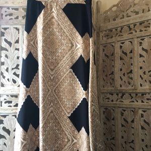 Black and tan medium women’s skirt. Waist 32” and length about 42” long .